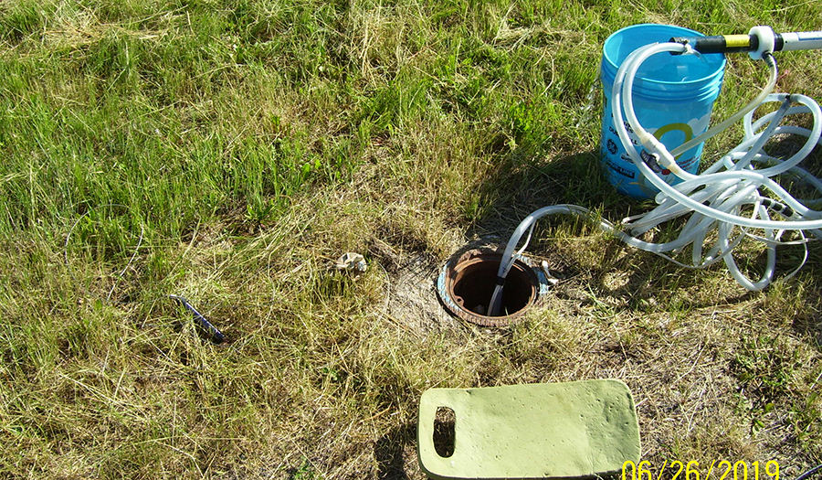 Groundwater sampling at airport monitoring well