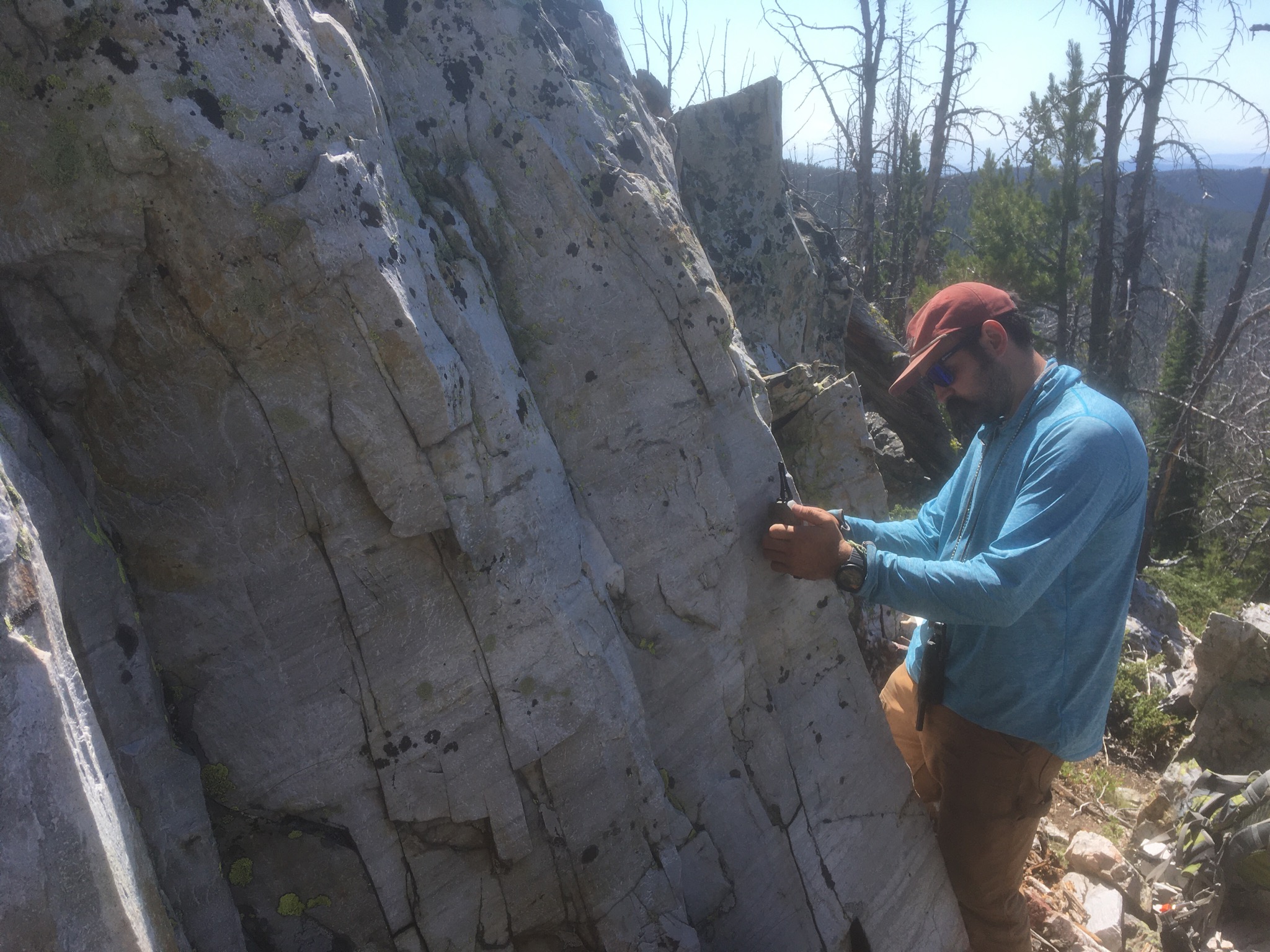 Montana Tech M.S. student Ethan Coppage measures bedding in Cambrian quartzite in the Elkhorn 7.5’ quadrangle