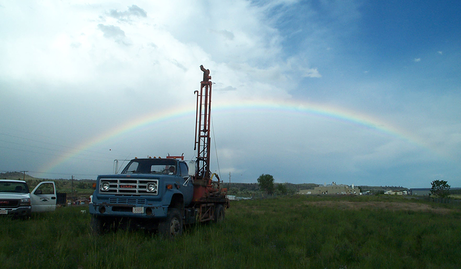 MBMG drill rig with rainbow celebrating another successful day of drilling